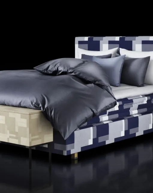 Bed with Appaloosa headboard by Hastens