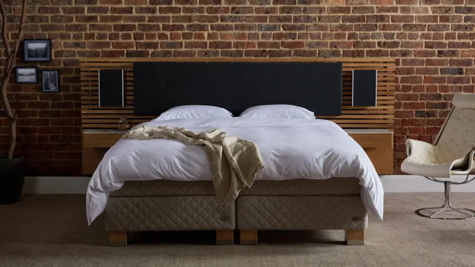 Bed with Audio headboard by Duxiana