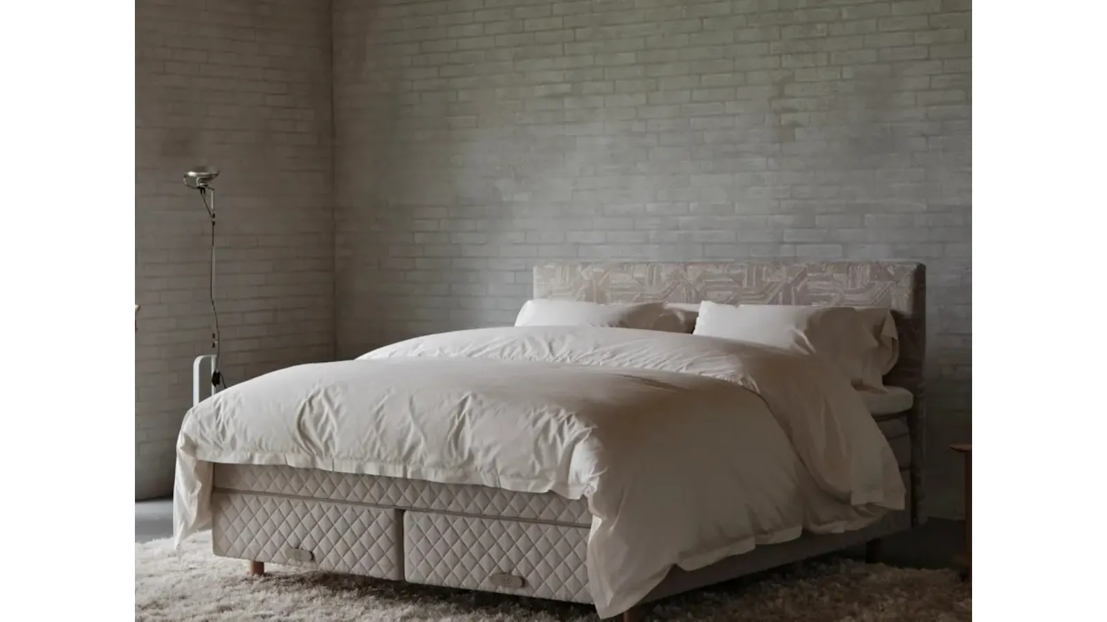 Bed with Astoria headboard by Duxiana