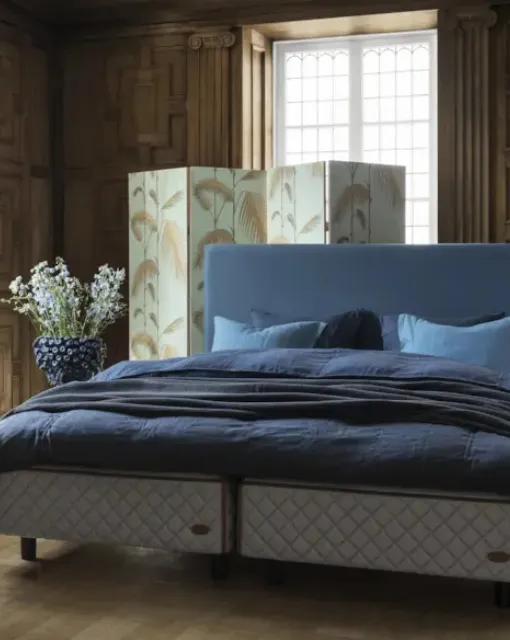 Bed with Astoria headboard by Duxiana