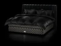 Fabric bed with Drēmər Black Shadow headboard by Hastens