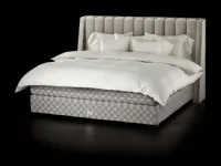 Fabric bed with Drēmər Natural Shale headboard by Hastens