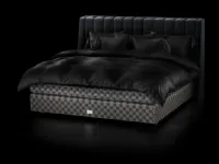 Fabric bed with Drēmər Phantom Charcoal headboard by Hastens