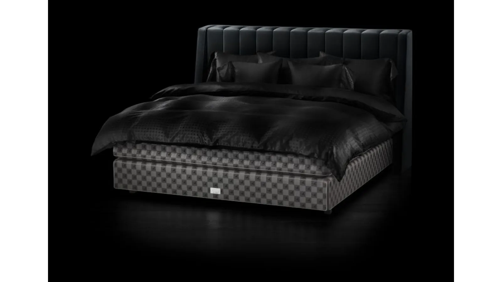 Fabric bed with Drēmər Phantom Charcoal headboard by Hastens