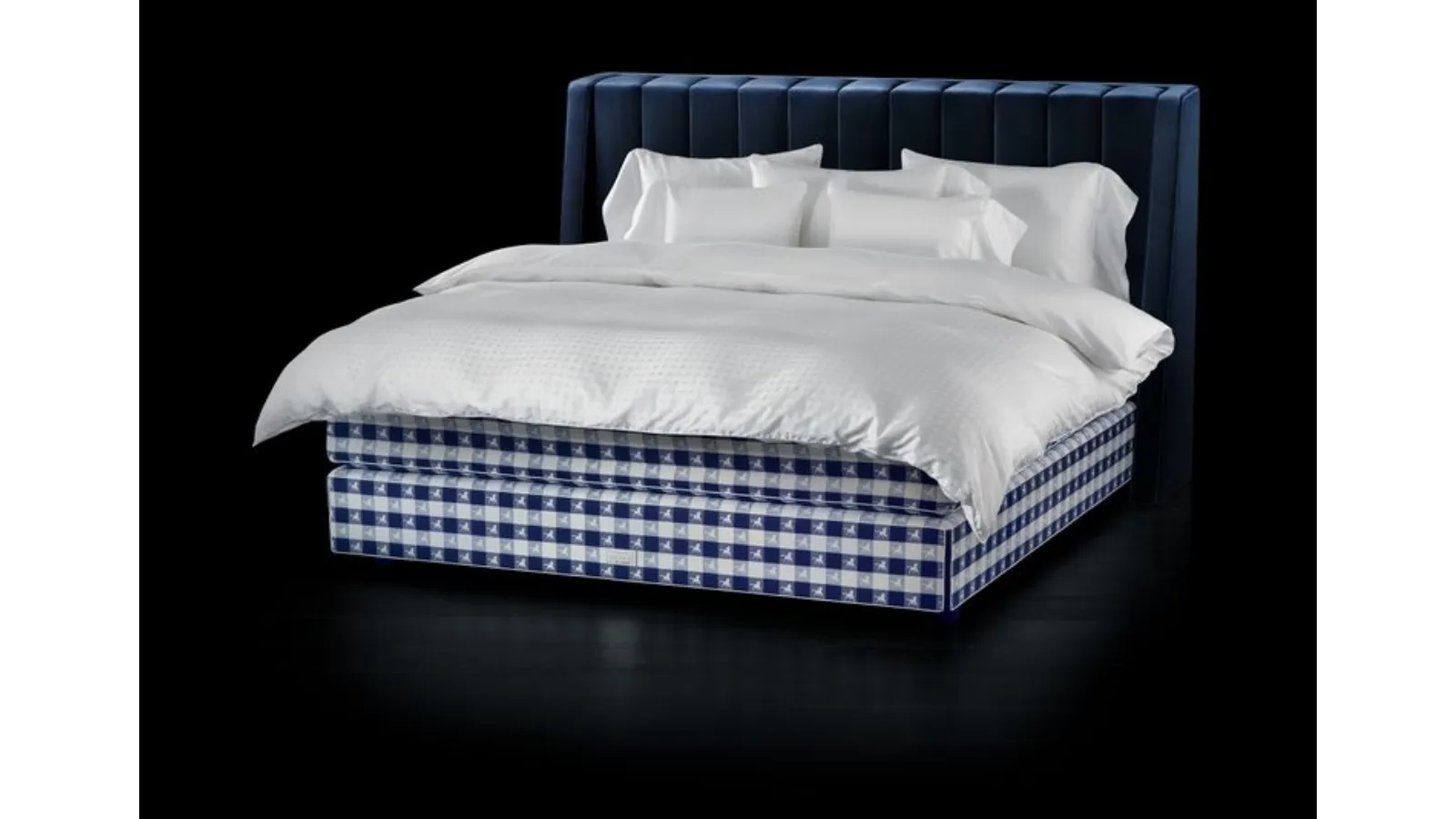 Fabric bed with Drēmər Traditional Blue headboard by Hastens