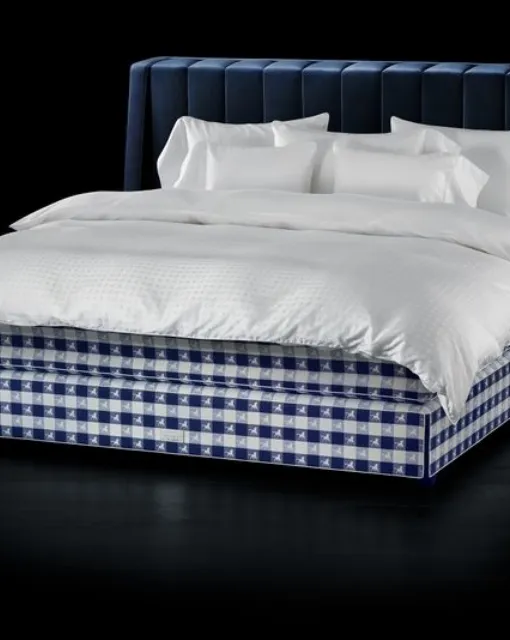 Fabric bed with Drēmər Traditional Blue headboard by Hastens