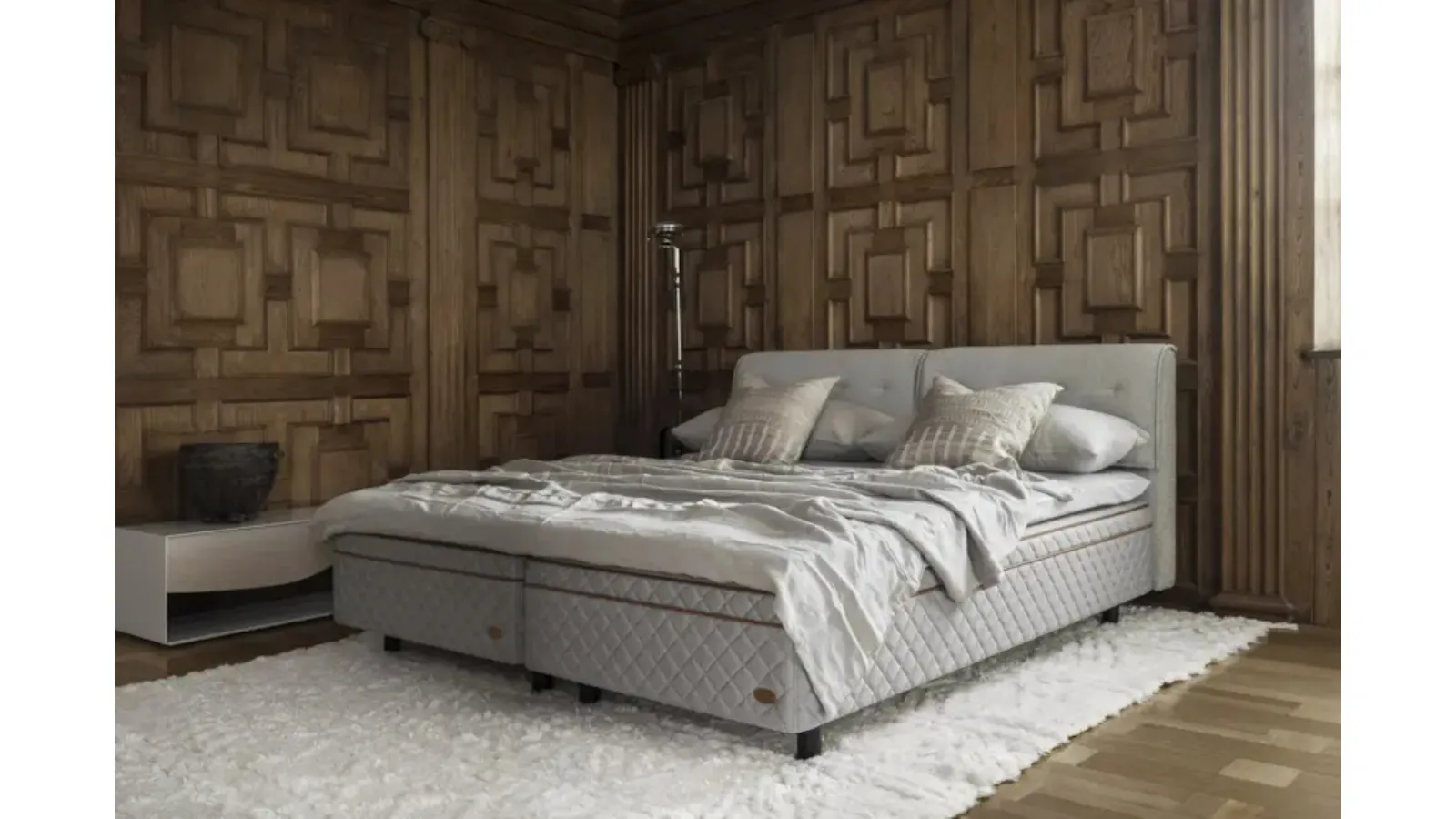 Bed with quilted fabric headboard by Duxiana