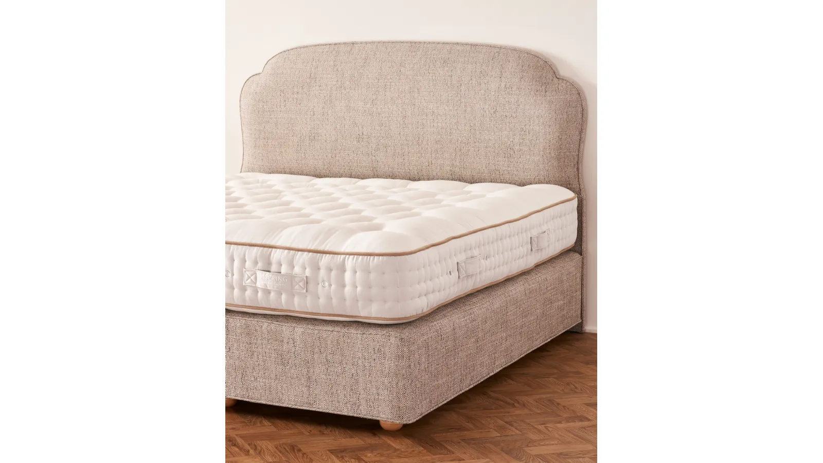Bed with Moncorvo headboard by Vispring