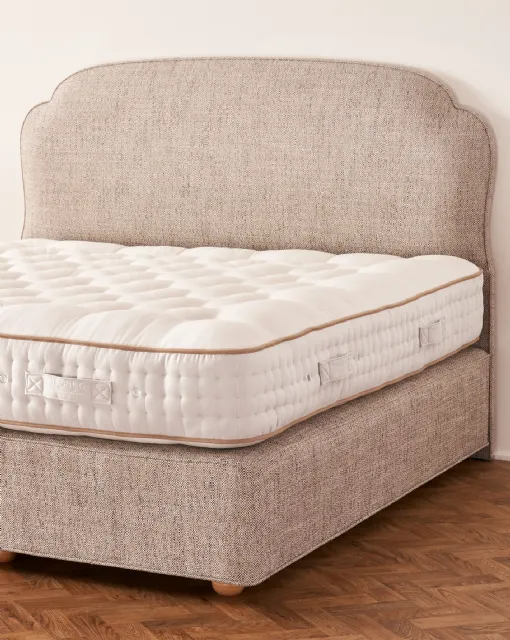 Bed with Moncorvo headboard by Vispring
